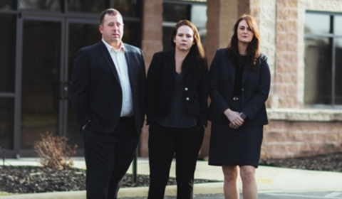 Patituce & Associates team standing outside law firm