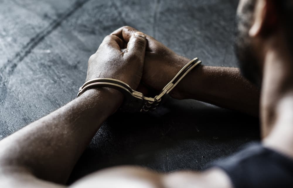 Man in custody with handcuffs on wrists